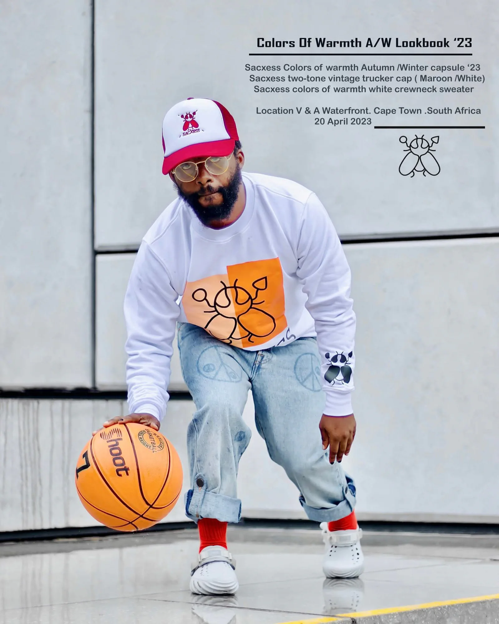 Archive campaign image: a man dribbling a basketball in a SACXESS cap and sweatshirt, with the original campaign caption